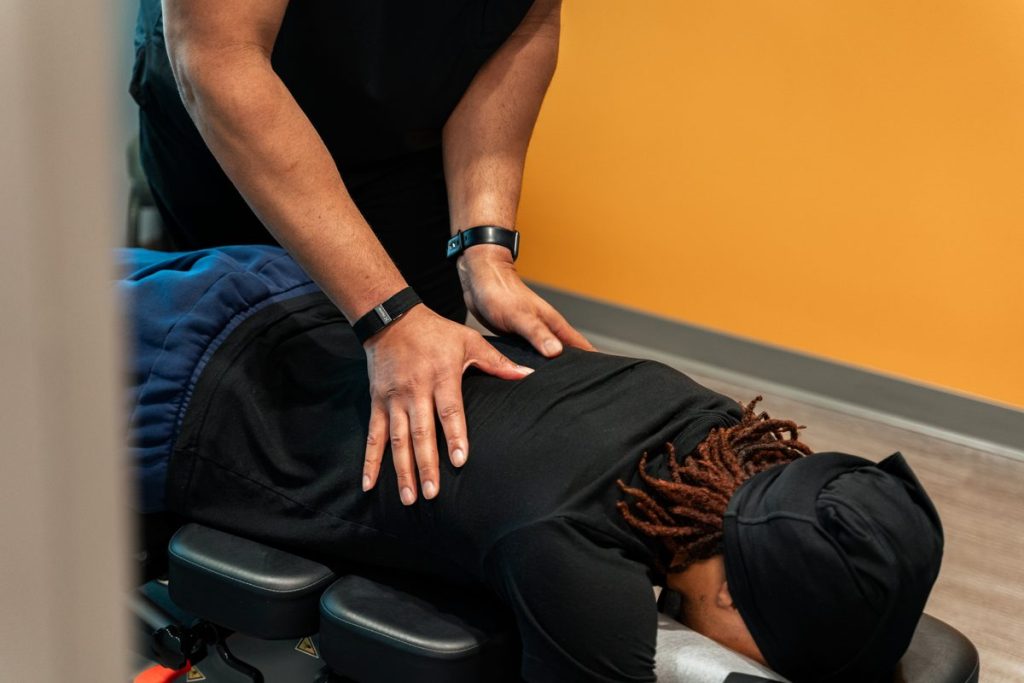 "Close-up of a chiropractor's hands performing a precision spinal adjustment"